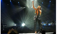 chris brown, rihanna breakup featured on concert stage